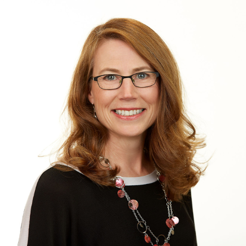 Jenifer DiVirgilio smiling in black sweater